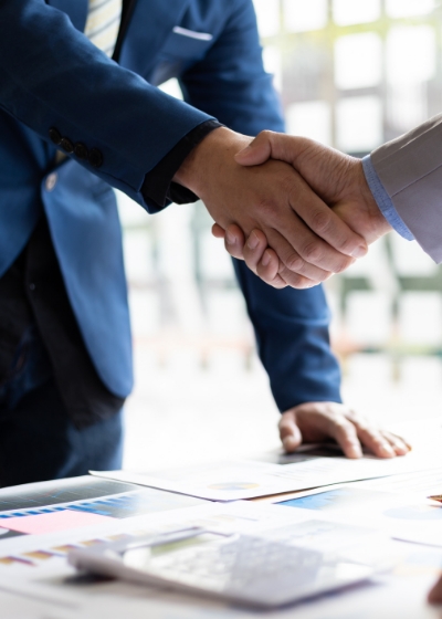 Handshake of a person in a suit
